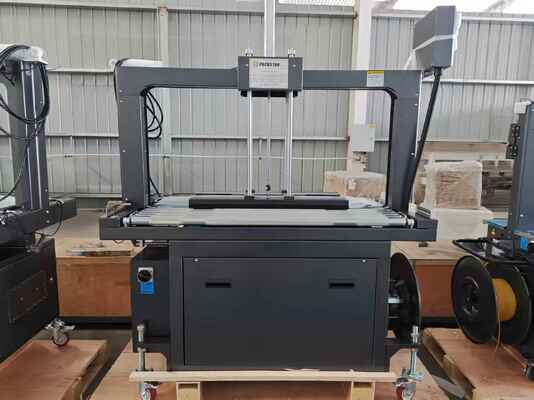 Qualität  Semi-Automatic 1200mm Carton Box Strapping Machine with One Year Warranty for Efficient Packing Fabrik